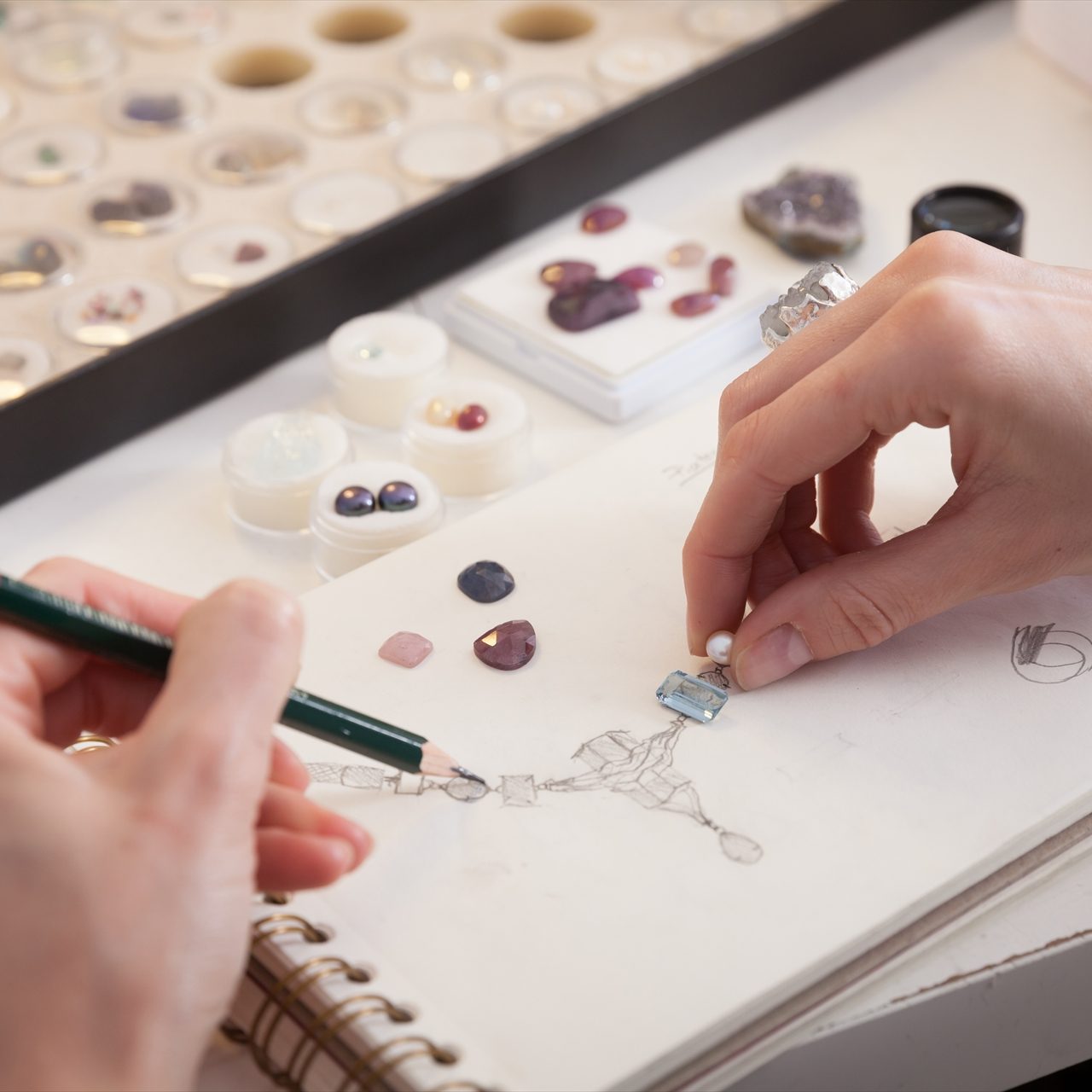 Jeweler at work, crafting in a jewelery workshop. Jeweler at work, crafting in a jewelery workshop.